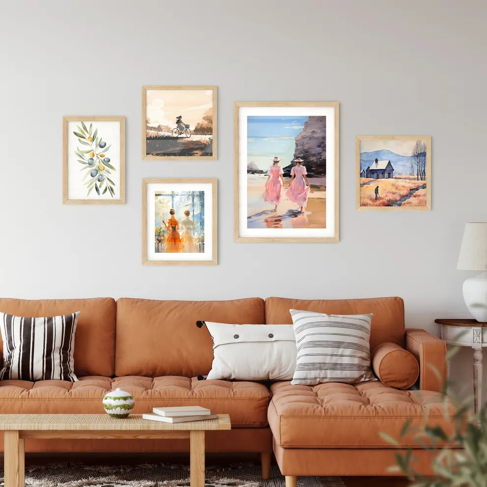Two Women In Pink Dresses Walking On A Beac Framed Print