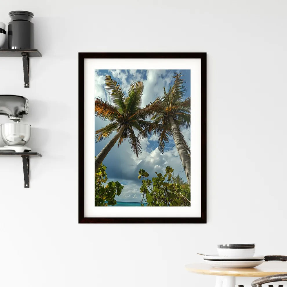 A Poster of two palm trees amidst a blue - A Framed Print