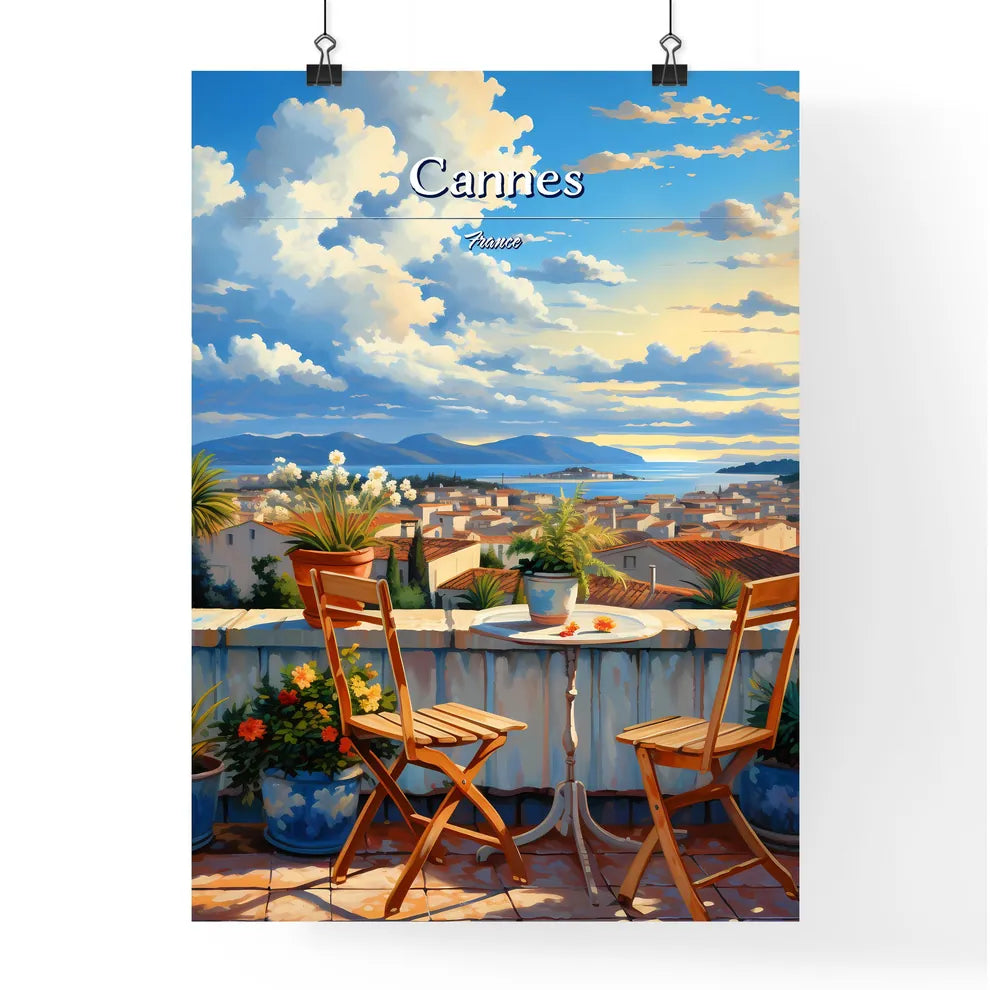 On the roofs of Cannes, France - Art print of a table and chairs on a balcony overlooking a city Poster