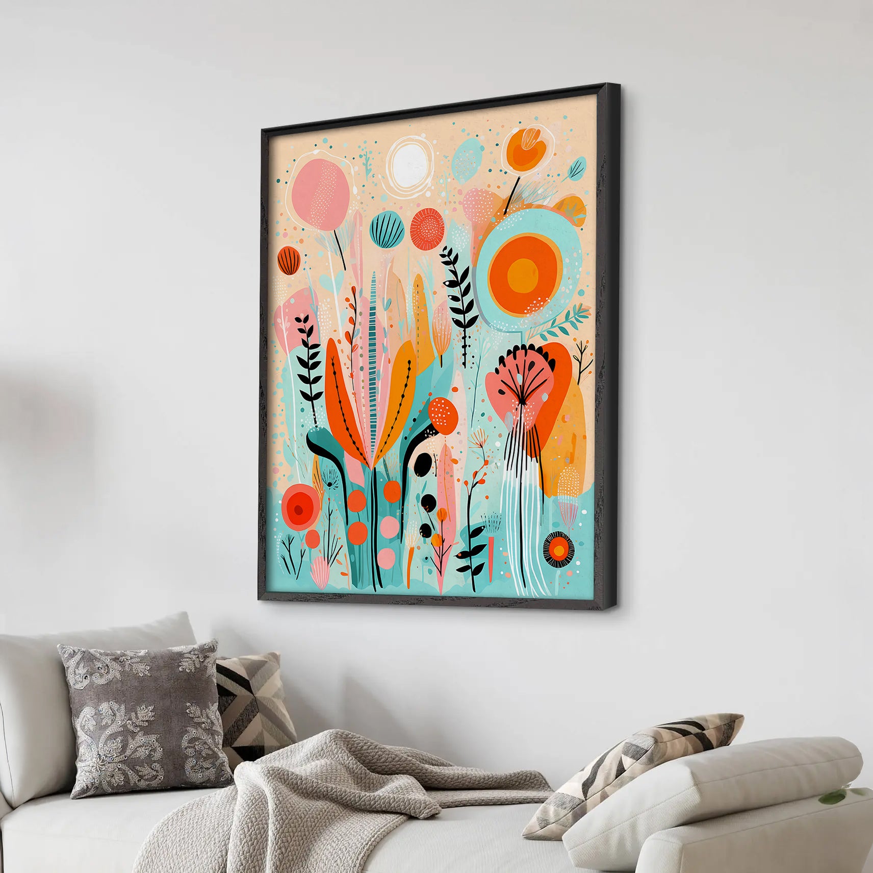 Colorful abstract art print on a wall above a sofa