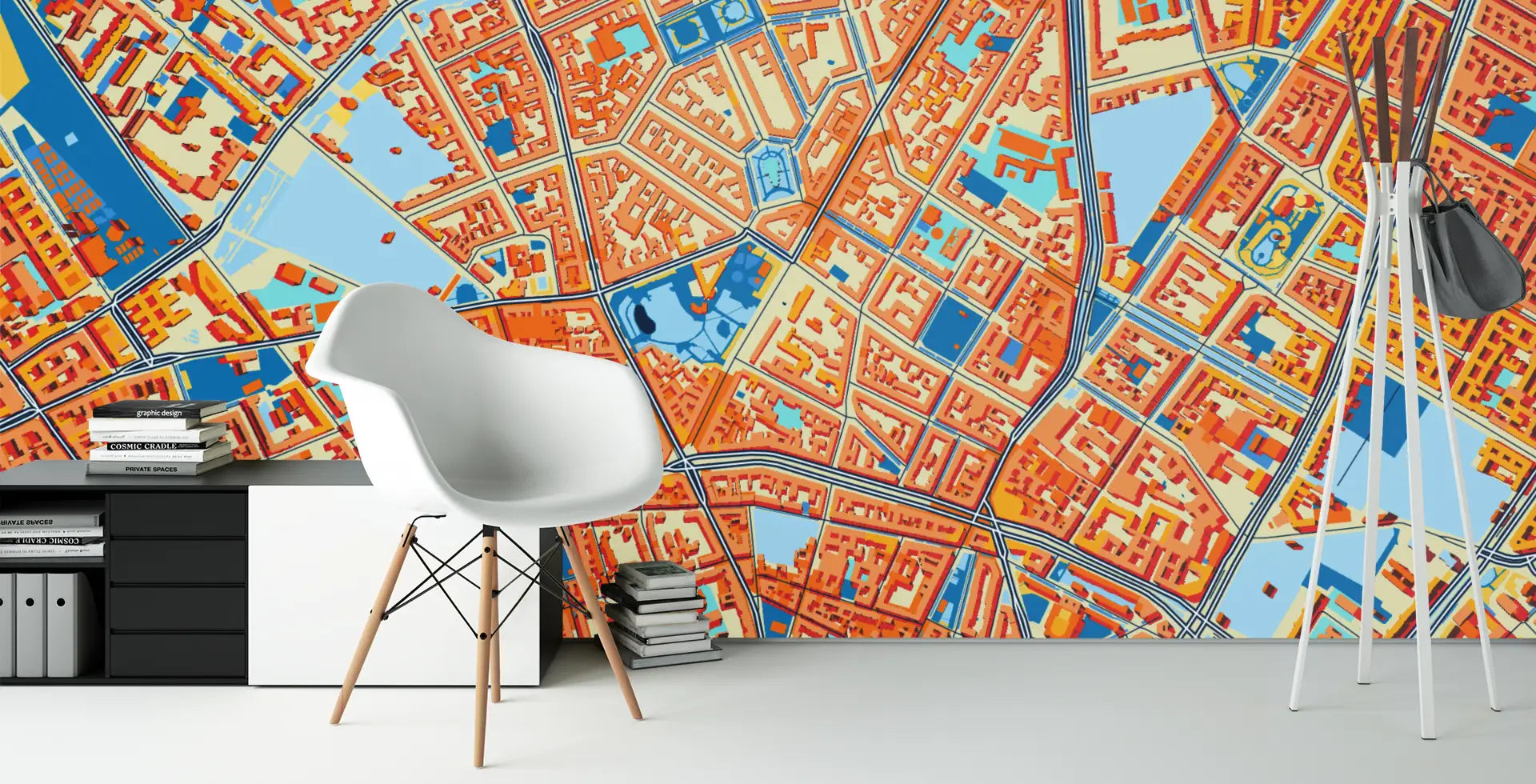 Colorful city map wallpaper in a room with a white chair and desk.