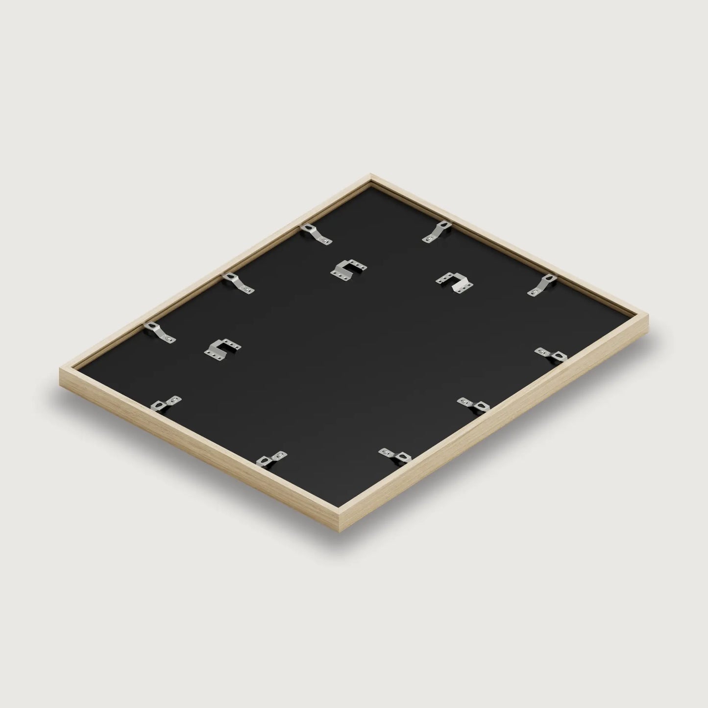 Blackboard with wooden frame and hooks on a light gray background