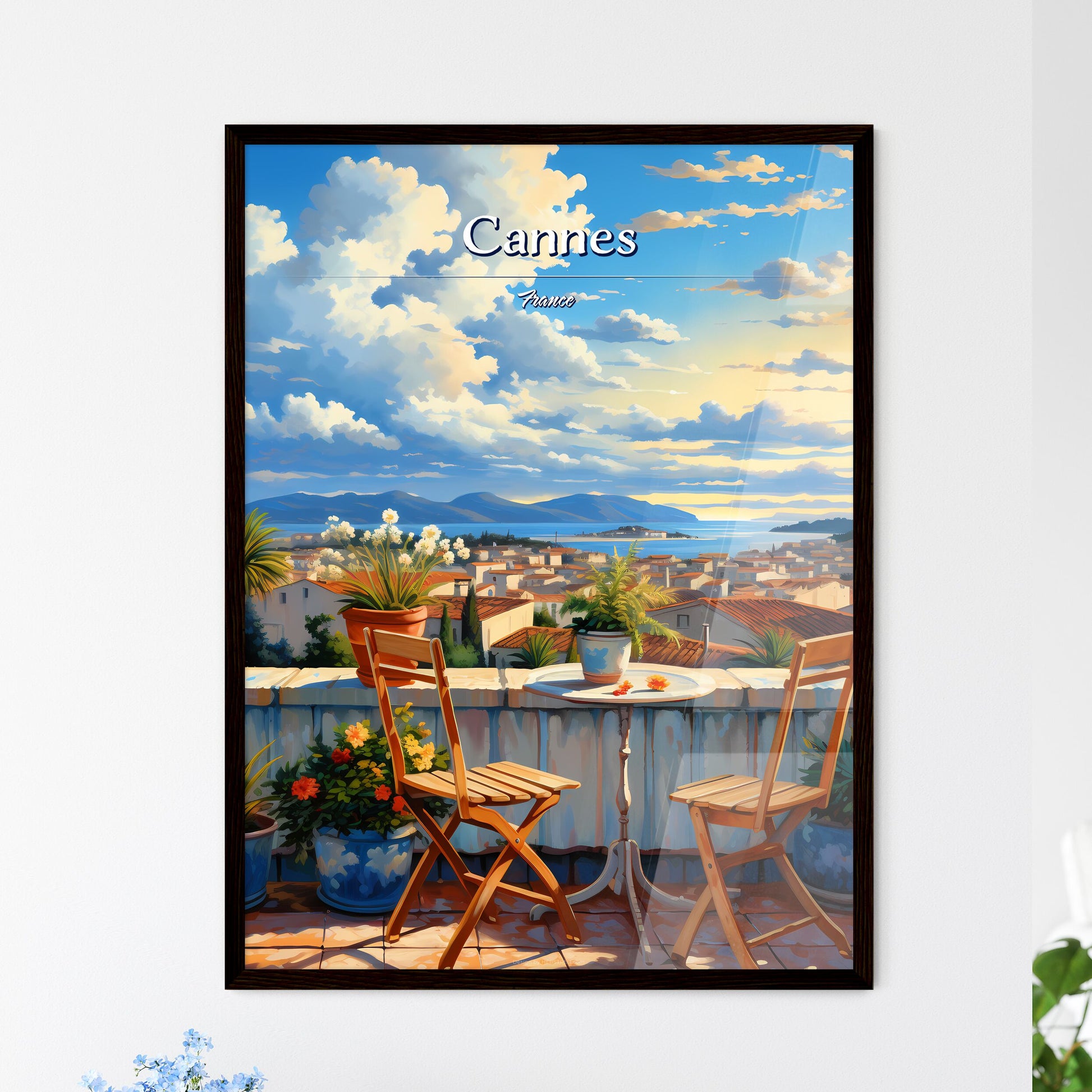 On the roofs of Cannes, France - Art print of a table and chairs on a balcony overlooking a city Framed Art
